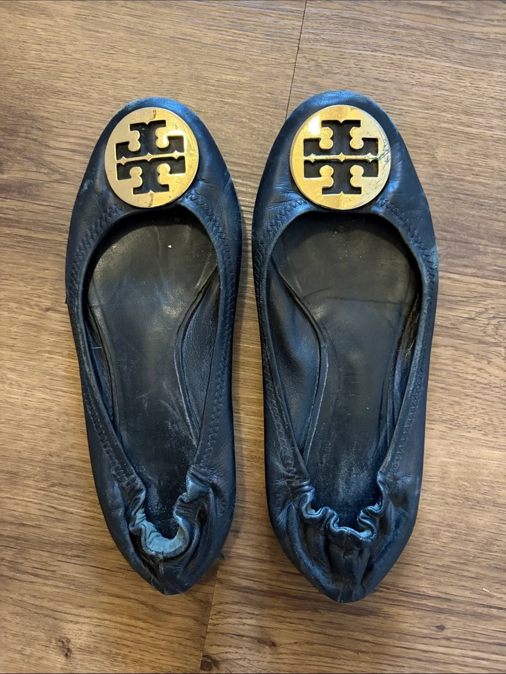 Tory Burch Black Leather Logo Round-Toe Flats with Gold Medallions - Picture 1 of 5